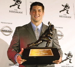 Florida quarterback Tim Tebow poses with the Heisman Trophy